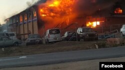 A Zimbabwe Revenue Authority warehouse burns in Beitbridge near the South African border.