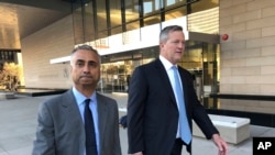 Imaad Zuberi, left, leaves the federal courthouse with his attorney Thomas O'Brien, right, in Los Angeles, Nov. 22, 2019. Zuberi pleaded guilty to funneling donations from foreigners to U.S. political campaigns. 