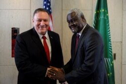 U.S. Secretary of State Mike Pompeo shakes hands with African Union Commission Chairperson Moussa Faki Mahamat at the African Union Headquarters in Addis Ababa, Ethiopia Feb. 18, 2020.
