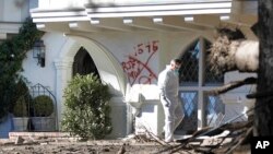 A Montecito resident searches his home for the first time near East Valley Road in Montecito, Calif., Jan. 25, 2018. 