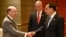 U.S. Secretary of Commerce Wilbur Ross shakes hands with China's Premier Li Keqiang, as U.S. National Security advisor Robert O'Brien watches, as they attend a bilateral meeting on the sidelines of the 35th Association of Southeast Asian Nations …