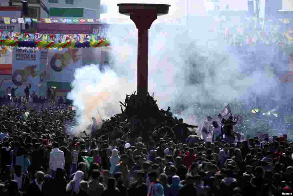 People gather to celebrate Nowruz, marking the arrival of spring and the new year, in Diyarbakir, Turkey.