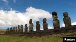 FILE - Statues named moai are seen on a hill at the Easter Island, Chile January 31, 2019. (REUTERS/Jorge Vega/File Photo)