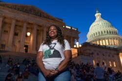 Rep. Cori Bush, D-Mo., speaks with reporters as she camps outside the U.S. Capitol, in Washington, Aug. 2, 2021.