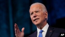 President-elect Joe Biden speaks after the Electoral College formally elected him as president, Dec. 14, 2020, at The Queen theater in Wilmington, Del.