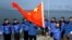 FILE - The Chinese national flag is raised in Longyearbyen on Svalbard, Norway, to set the site of a Chinese research station, Oct. 31, 2001. A new State Department report highlights the recent expansion of China's activities in the Arctic.
