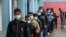 Palestinian students wait to receive a dose of the Pfizer-BioNTech vaccine against COVID-19 at a school of the UN Relief and Works Agency (UNRWA) in Gaza's al-Shati refugee camp, Jan. 24, 2022.