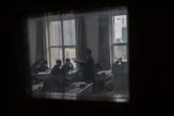 Ethnic minority students attend a class at the Urumqi Islamic Institution during a government-organized trip for foreign journalists in Urumqi on April 22, 2021.