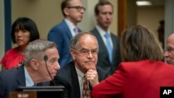 Rep. Jim Cooper, D-Tenn. (C), and Rep. Stephen F. Lynch, D-Mass. (L), confer with other Democrats as the House Oversight and Reform Committee considers whether to hold Attorney General William Barr and Commerce Sec. Wilbur Ross in contempt, June 12, 2019.