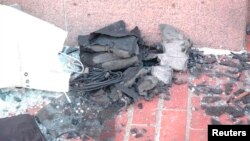 Boston Marathon bomb scene pictures taken by investigators show the remains of an explosive device, April 16, 2013. 