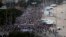 People march during an anti-government protest at the Copacabana beach, in Rio de Janeiro, Brazil, June 23, 2013. 