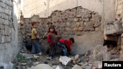 Children play in the old city of Aleppo, Syria, Feb. 4, 2014.