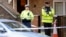 Police officers attend the scene of a shooting at Poplar Row in Dublin, Ireland, Feb. 9, 2016.