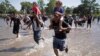 Hundreds in River 'No-Man's Land' After Mexico Troops Block Way