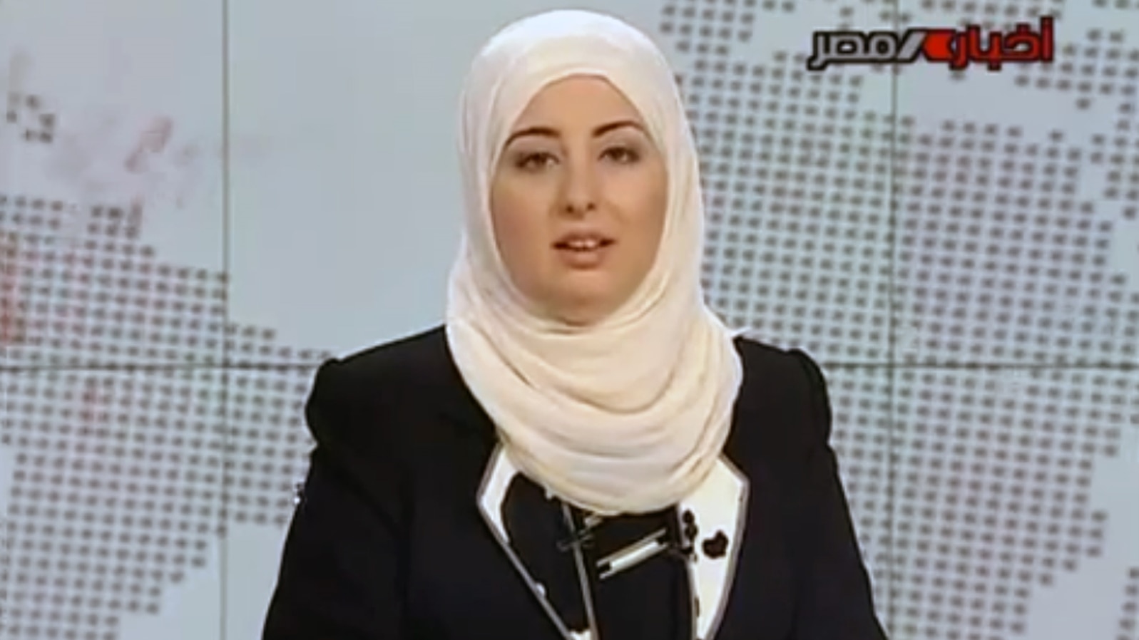 Egypt State TV, Fatma Nabil reads out the headlines wearing a headscarf on the noon news bulletin on state television in Cairo, Egypt, Sept. 3, 2012.