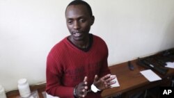 Kenyan Elgiva Bwire Oliacha alias Mohamed Seif reacts after his sentencing in Nairobi, October 28, 2011.