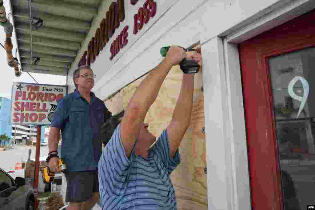 Residents board up a sea shell store ahead of Hurricane Milton&rsquo;s expected landfall in the middle of this week in Treasure Island, Florida, Oct. 7, 2024.