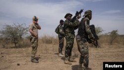 FILE - A U.S. special forces soldier trains Nigerian soldiers during Flintlock 2016, a U.S.-led international training exercise with African militaries in Thies, Senegal, Feb. 11, 2016.