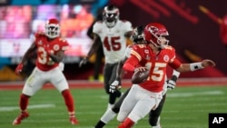 Kansas City Chiefs quarterback Patrick Mahomes looks to throw against the Tampa Bay Buccaneers during the second half of the NFL Super Bowl 55 football game, in Tampa, Florida, Feb. 7, 2021. 