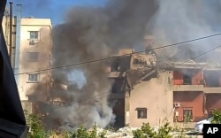 Smoke rises from a gathering  deed  by an Israeli airstrike, successful  the confederate  larboard  metropolis  of Sidon, Lebanon, Oct. 27, 2024.