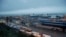 FILE - Trucks wait in lines to drive onto ferries at the Port of Dover, Britain, Feb. 1, 2020.