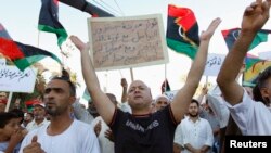 Supporters of Operation Dawn, a group of Islamist-leaning forces mainly from Misrata, demonstrate against the Libyan parliament, Tripoli, Aug. 29, 2014.