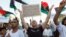 Supporters of Operation Dawn, a group of Islamist-leaning forces mainly from Misrata, demonstrate against the Libyan parliament, Tripoli, Aug. 29, 2014.