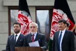 FILE - Afghanistan's Abdullah Abdullah speaks to his supporters after his swearing-in ceremony as president, in Kabul, Afghanistan, March 9, 2020.