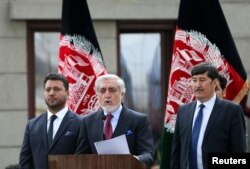 FILE - Afghanistan's Abdullah Abdullah speaks to his supporters after his swearing-in ceremony as president, in Kabul, Afghanistan, March 9, 2020.