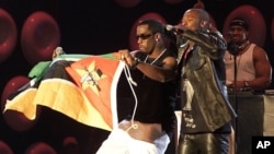 U.S. superstar, Sean "P Diddy" Combs, left, was joined by South African Kwaito musician Mandoza at a concert in Cape Town South Africa, November 23, 2002.