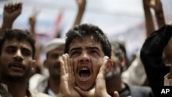 A protester shouts slogans during a demonstration to demand the resignation of Yemen's President Ali Abdullah Saleh in Sanaa, Yemen, Sept. 29, 2011.