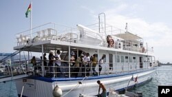 A diver prepares to inspect the Stefano Chiarini ship, part of the "Freedom Flotilla II," which is due to set sail to Gaza from Greece, in Corfu, July 1, 2011.