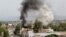 Smoke rises from the site of a blast and gunbattle between Afghan security forces and a handful of militants in Jalalabad city, Afghanistan, May 13, 2018. 