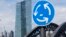 A traffic sign stands next to the headquarters of the European Central Bank in Frankfurt, Germany, June 16, 2015.