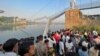 Nine Arrested After India Bridge Collapses, Killing 134