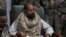 Saif al-Islam Gadhafi in custody of revolutionary fighters shortly after his capture, Obari, Libya, Nov. 19, 2011.