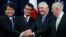From left, Japanese Defense Minister Itsunori Onodera, Japanese Foreign Minister Taro Kono, Secretary of State Rex Tillerson and Defense Secretary James Mattis shake hands "ASEAN style" at the start of a Security Consultative Committee meeting at the State Department in Washington, Aug. 17, 2017.