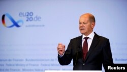 FILE - German Vice Chancellor and Finance Minister Olaf Scholz attends a joint news conference with Justice Minister Christine Lambrecht in Berlin, Germany, Oct. 7, 2020.