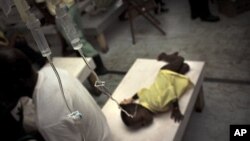 A boy suffering cholera symptoms receives treatment at the Doctors Without Borders temporary hospital in Port-au-Prince, Haiti, 16 Nov. 2010.