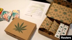 FILE - Cannabis product boxes are displayed at The Cannabis World Congress & Business Exposition (CWCBExpo) trade show in New York City, New York, May 30, 2019.
