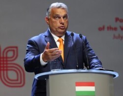 FILE - Viktor Orban Prime Minister of Hungary attends a news conference following talks with his counterparts from central Europe's Visegrad Group in Lublin, Poland, Sept. 11, 2020.