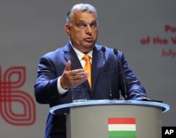 FILE - Viktor Orban Prime Minister of Hungary attends a news conference following talks with his counterparts from central Europe's Visegrad Group in Lublin, Poland, Sept. 11, 2020.