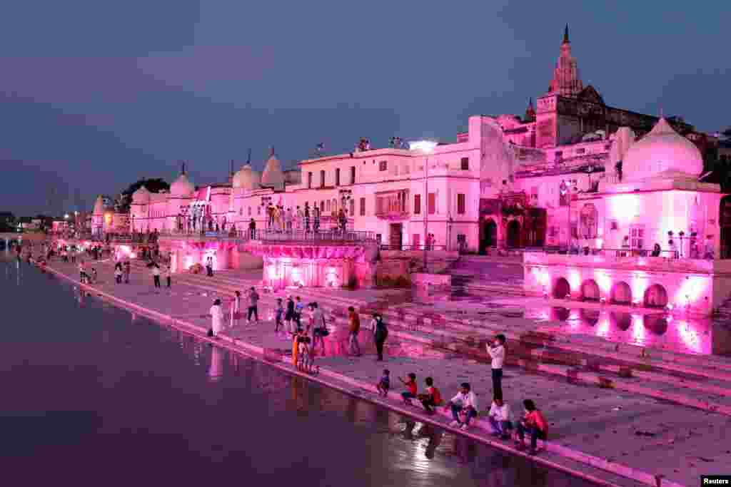 Illuminated temples and other buildings can be seen along a bank of the Sarayu River ahead of the foundation-laying ceremony for a Hindu temple in Ayodhya, India, Aug. 4, 2020.