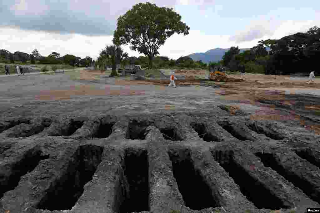 Recently dug graves are seen at an area for victims of the coronavirus pandemic at the La Bermeja cemetery, as theCOVID-19 outbreak continues in San Salvador, El Salvador, July 21, 2020.