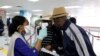Haitians cross from the Dominican Republic into Malpasse, Haiti, March 17, 2020. Haitian authorities shut down the country's border with the Dominican Republic on Monday as a precaution against the spread of the new coronavirus.