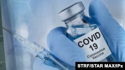 A sign for a COVID-19 vaccine is seen in White Plains, N.Y. Johnson & Johnson said Aug. 25, 2021, that a booster shot for its vaccine after six months may have big benefits. 