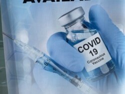 A sign for a COVID-19 vaccine is seen in White Plains, N.Y. Johnson & Johnson said Aug. 25, 2021, that a booster shot for its vaccine after six months may have big benefits.