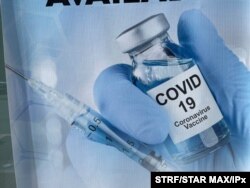 A sign for a COVID-19 vaccine is seen in White Plains, N.Y. Johnson & Johnson said Aug. 25, 2021, that a booster shot for its vaccine after six months may have big benefits.