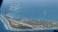 FILE - Funafuti, the main island of the nation state of Tuvalu, is photographed from a Royal New Zealand airforce C130 aircraft as it approaches the tiny South Pacific nation.