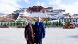 U.S. Ambassador to China Terry Branstad and his wife Christine pose for a photo in front of the Potala Palace in Lhasa in western China's Tibet Autonomous Region. 